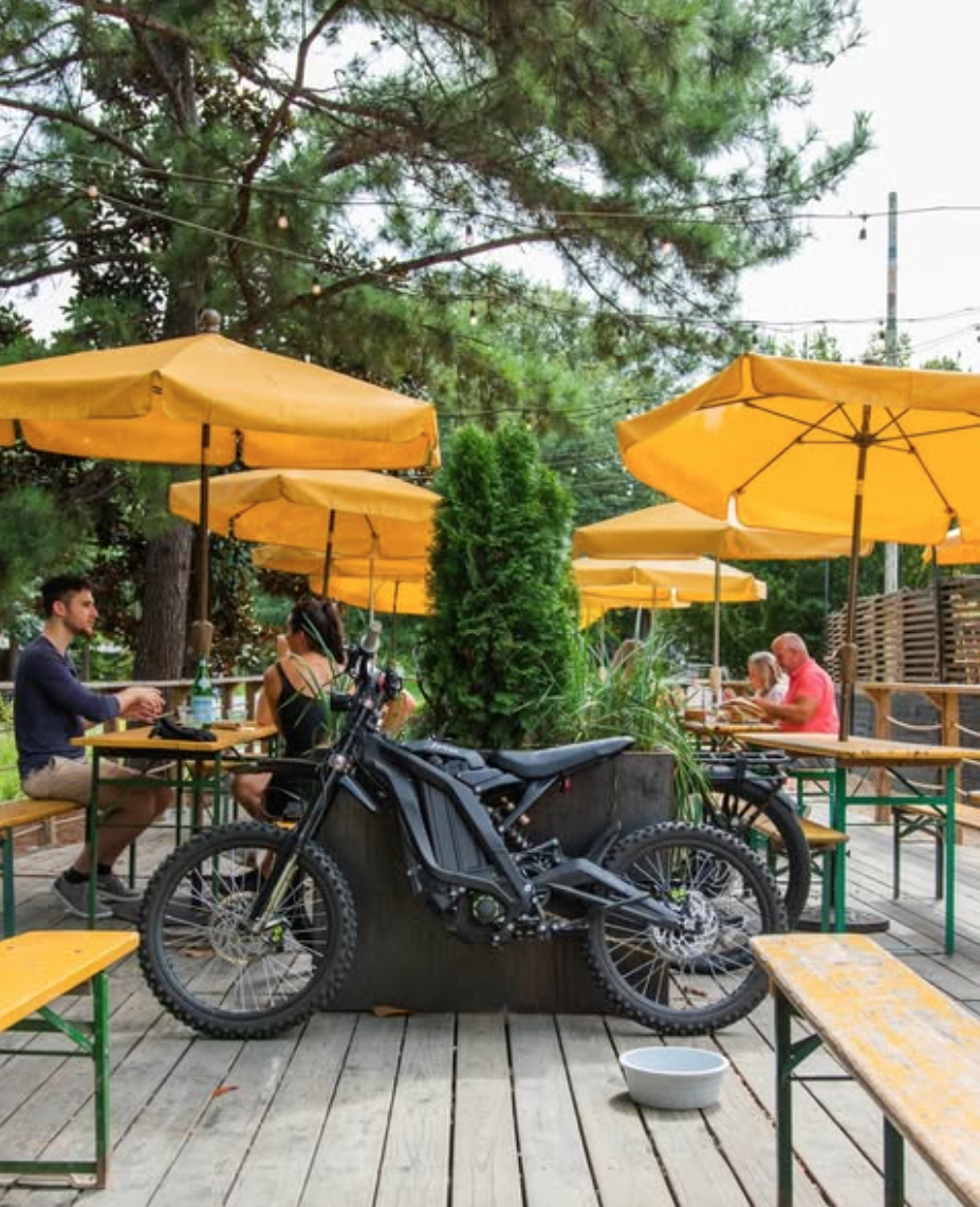 ladybird atlanta pato shot witih yellow umbrellas, motorcycle, and dog bowl